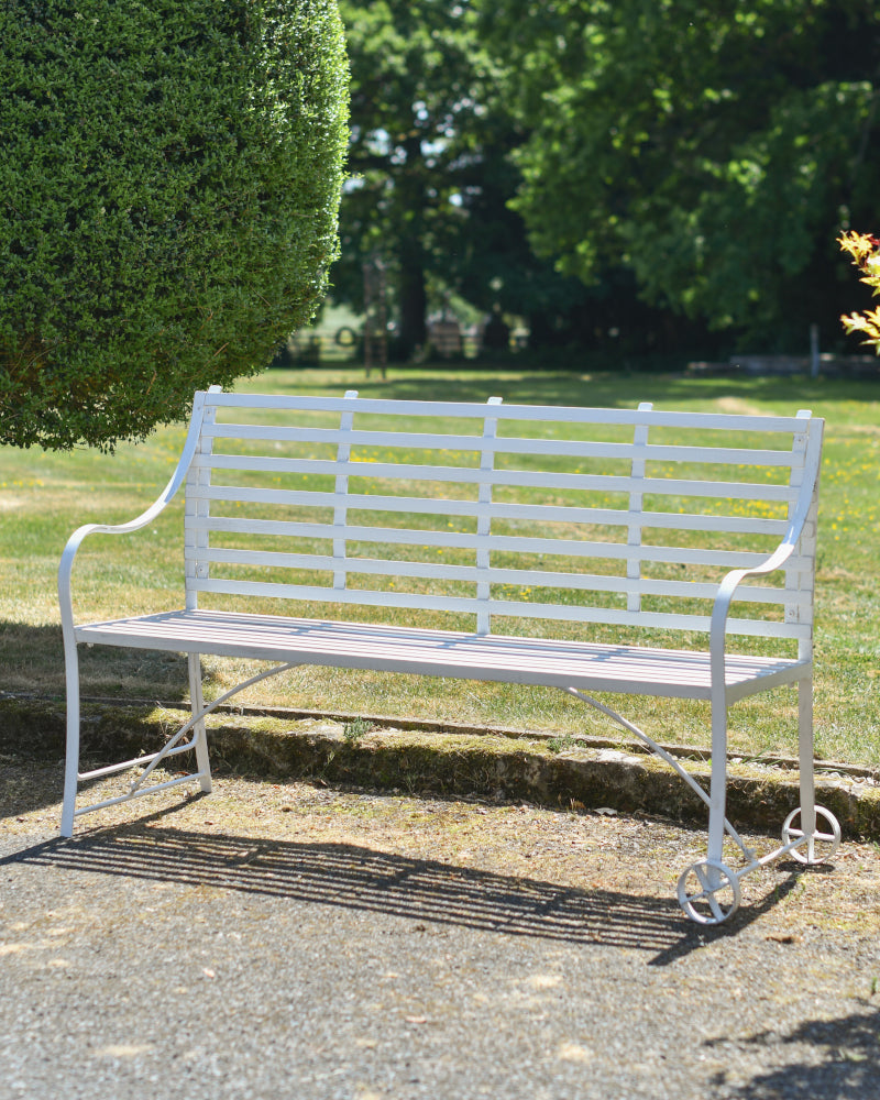 Angled view of the 'Lowbridge' bench in the garden
