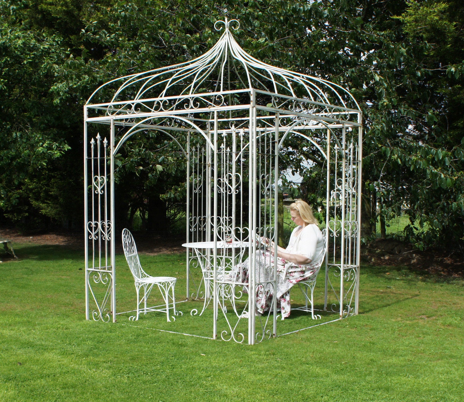metal garden structure with table and chairs