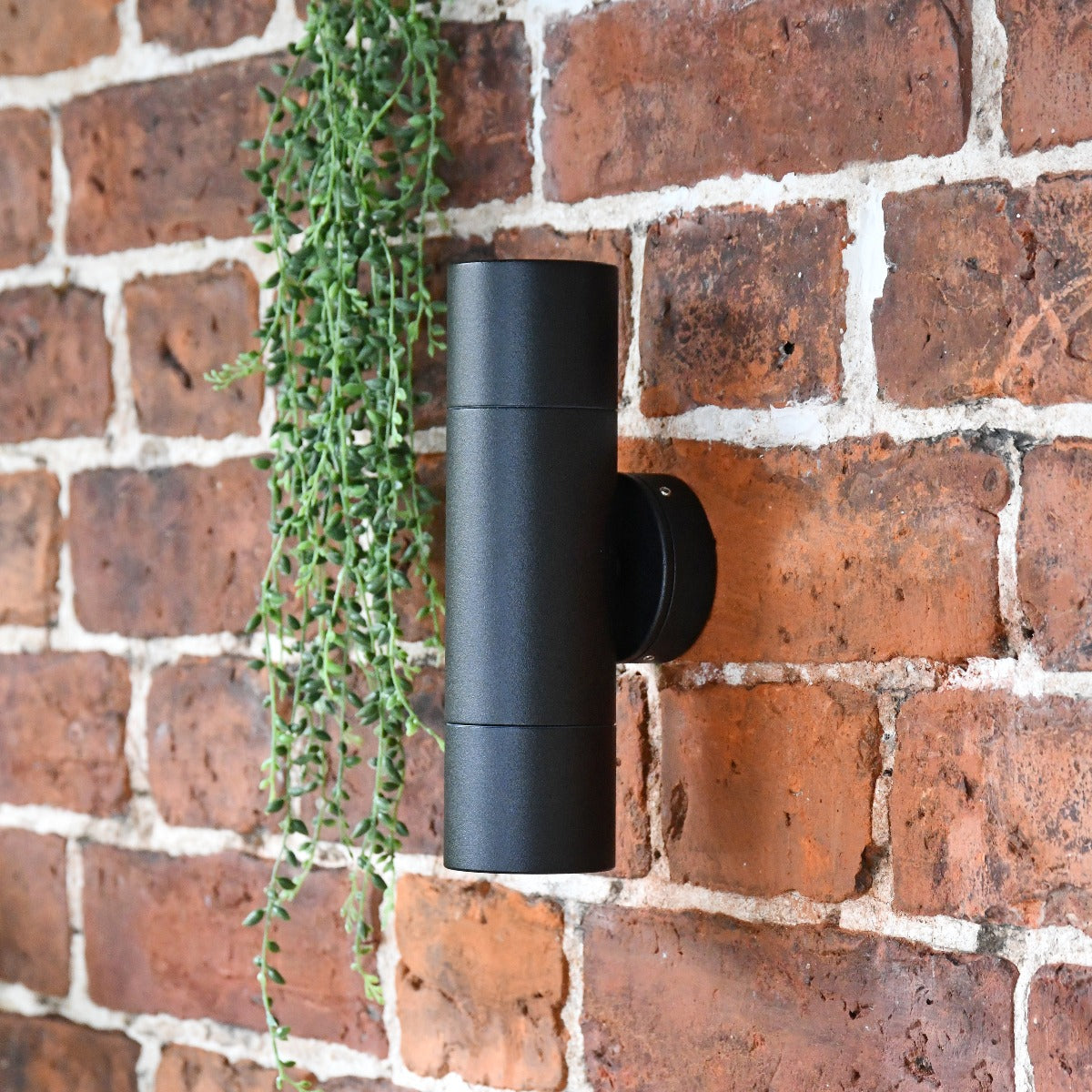 Cylindrical Wall Spotlight in a black powder coating finish 