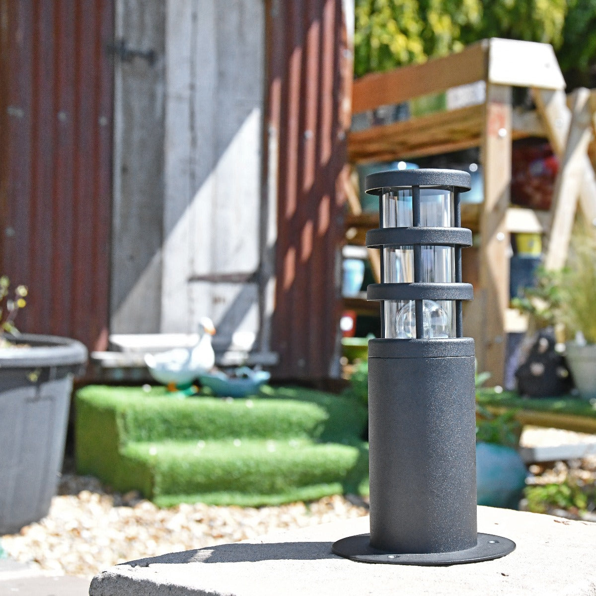 Modern Black Stainless Steel Pillar Light  On Stone Pillar