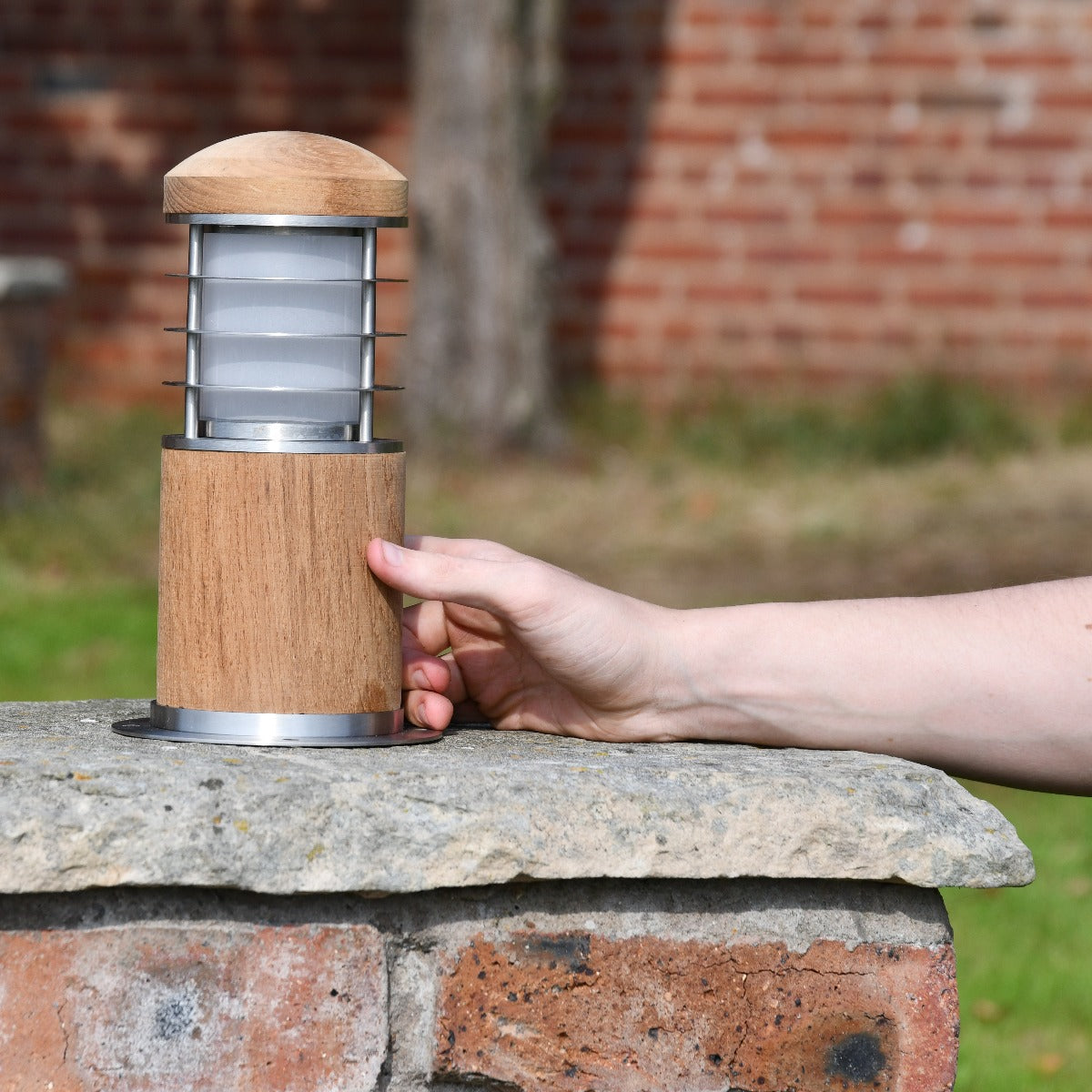 Modern Low Level Driveway Lighting Bollard On Stone Wall