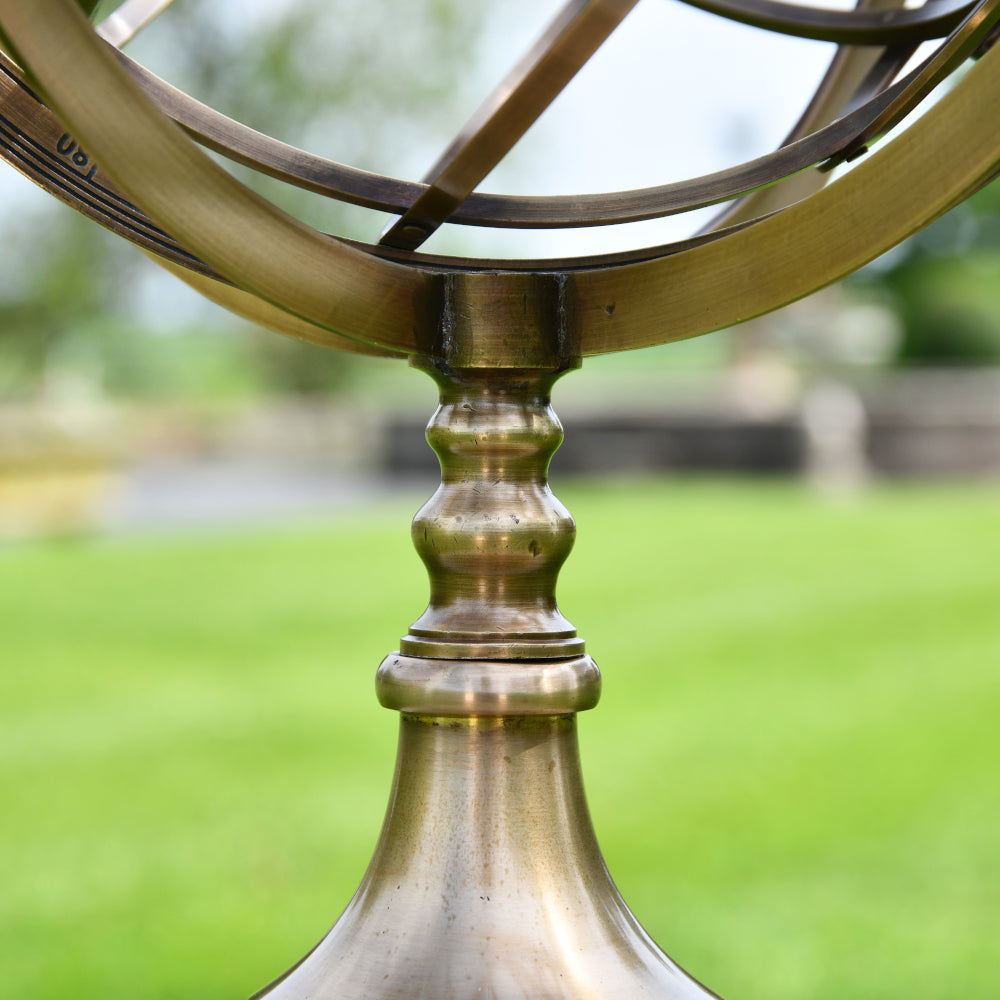 Ornate apex of the brass base