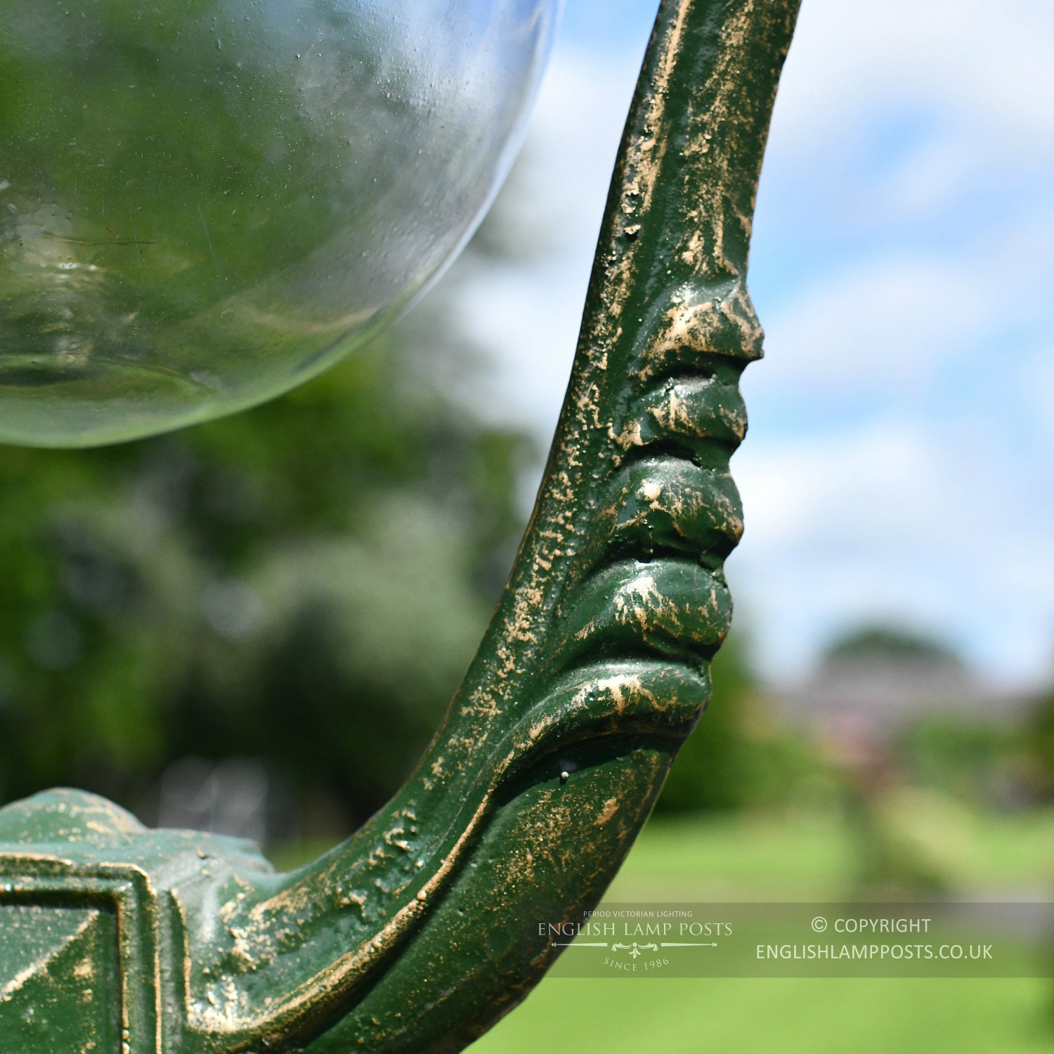 Ornate Scroll Work On Green Lamp Post Column