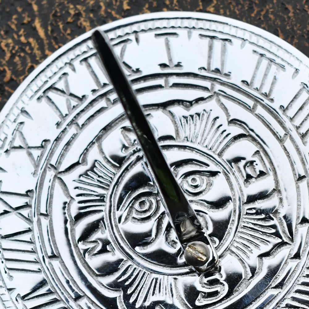 Close up of the embossed sun motif