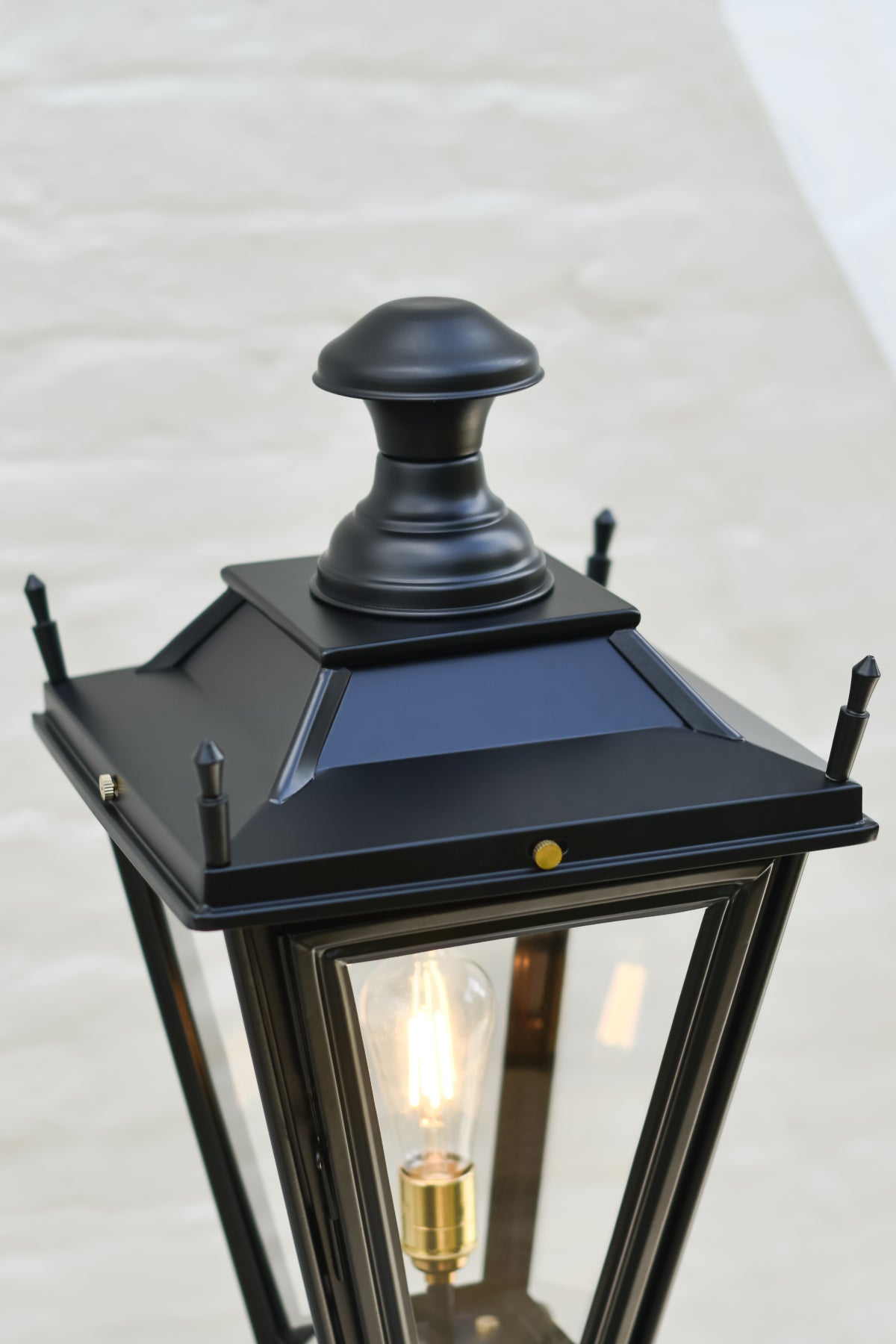 The tiered apex of the black 'Dorchester' lamp post