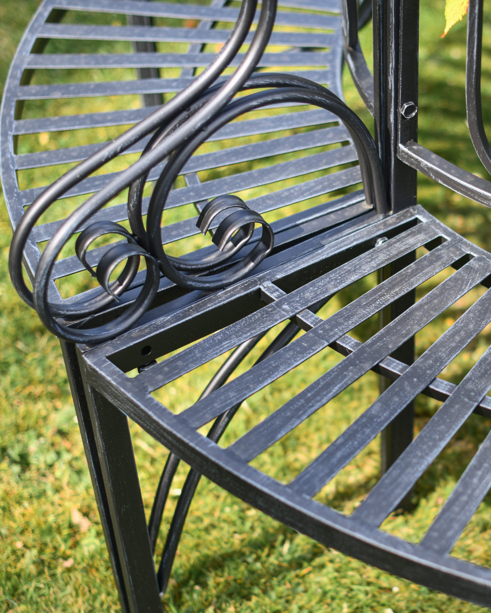 Close up of the scrolled bench arm
