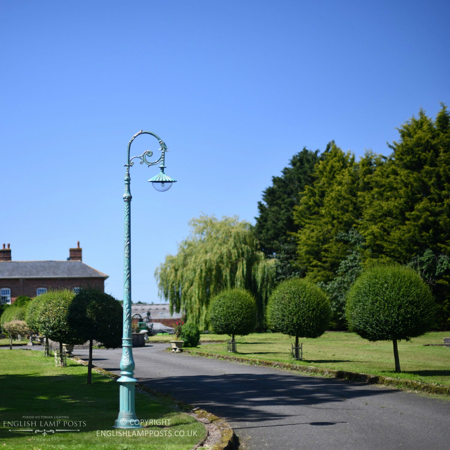 Pale Blue Victorian Lamp Post Installed On Edge Of Driveway