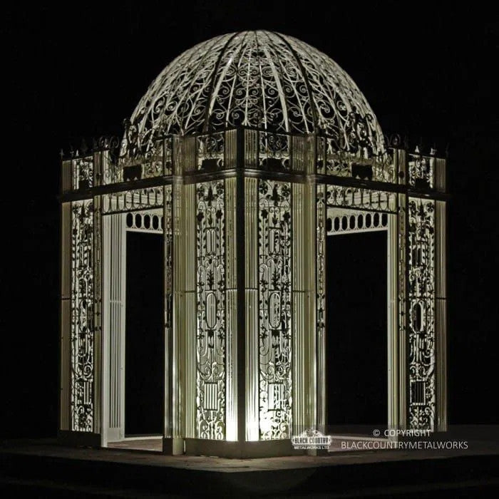 The Royal Alexandria Gazebo In Cream lit up in the dark 