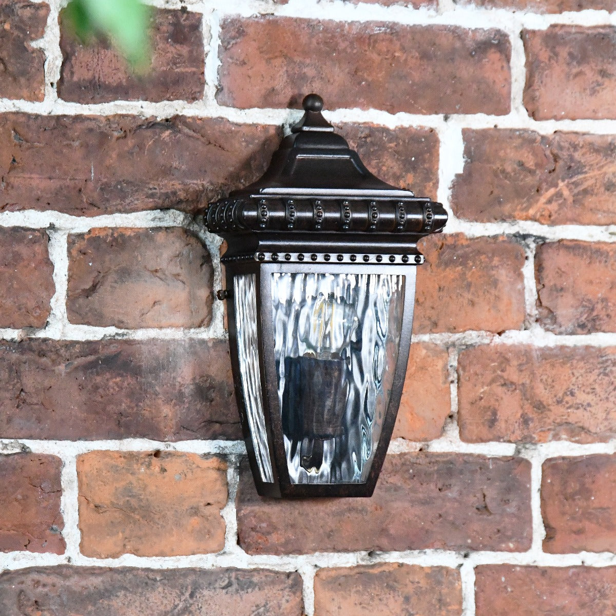 Period Inspired Flush Light On Brick Wall