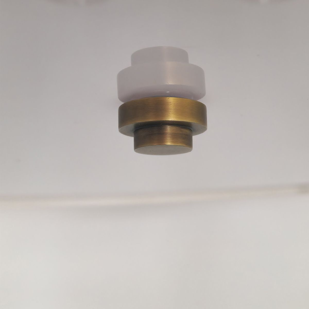Magnified view of the brass centre finial 