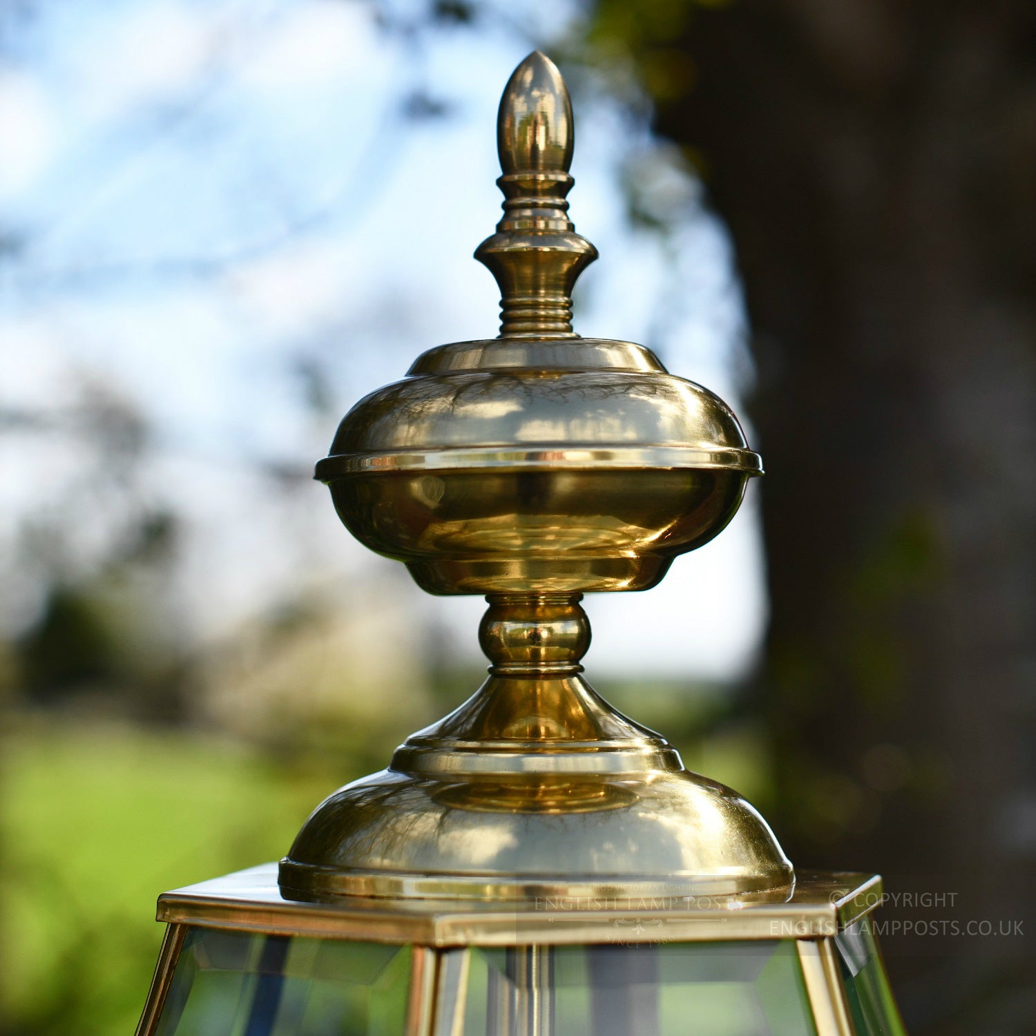 Polished brass finial on external pillar lantern
