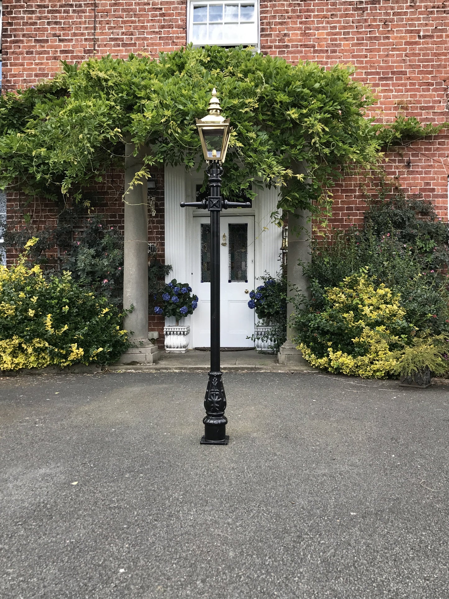 Polished Brass Victorian Lamp Post by a front door