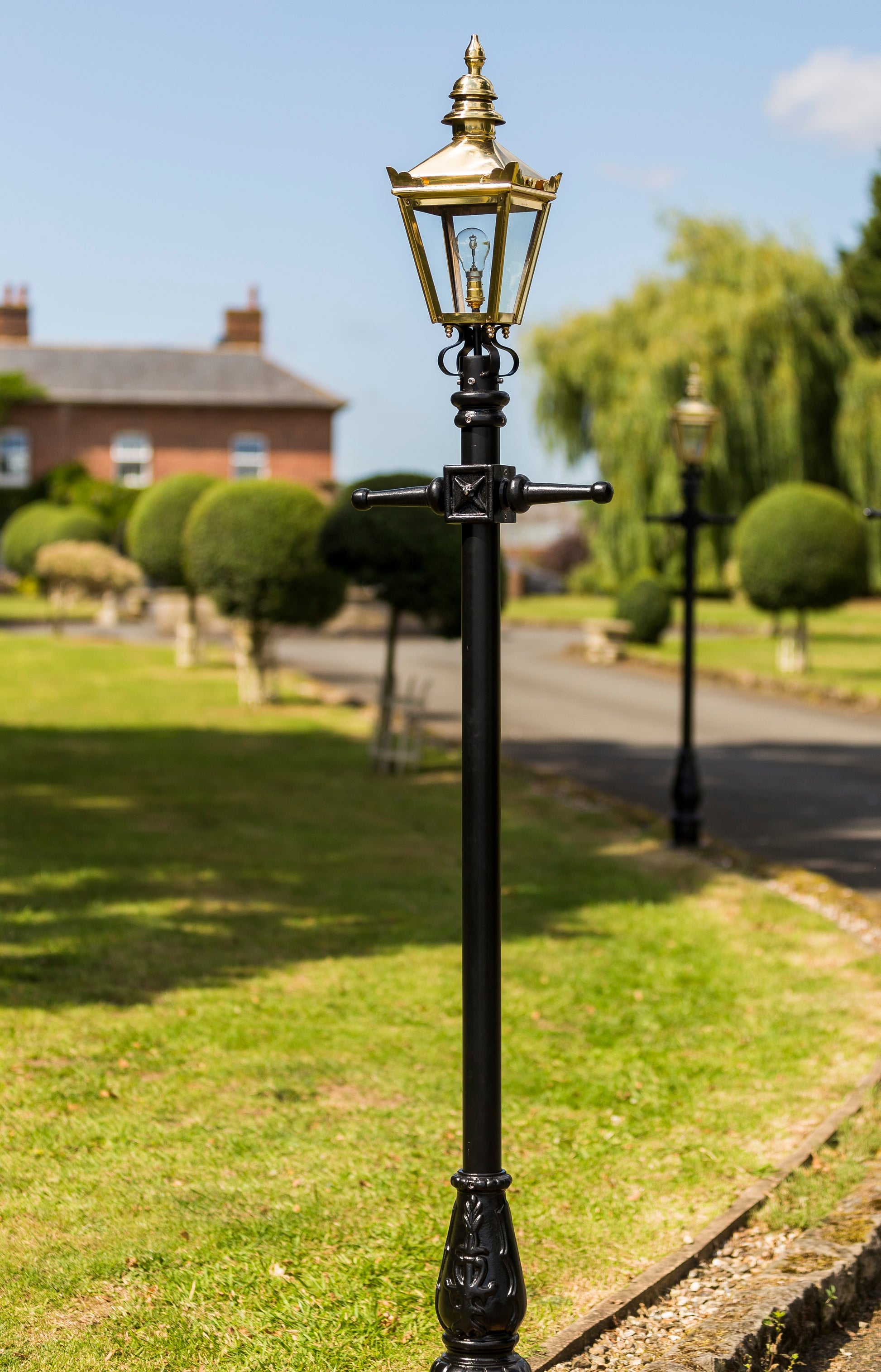 Polished Brass Kensington Lamp Post 2.25m In A Garden Setting