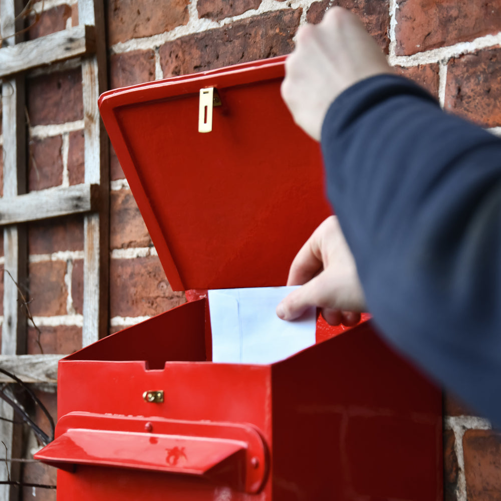 View of the post being retrieved from the 'Cambourne' post box