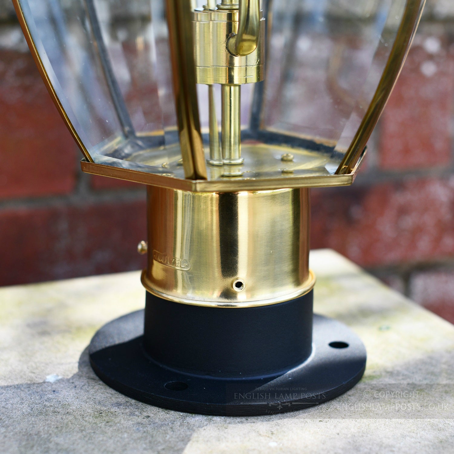 Rounded mounting plate on classical brass lantern