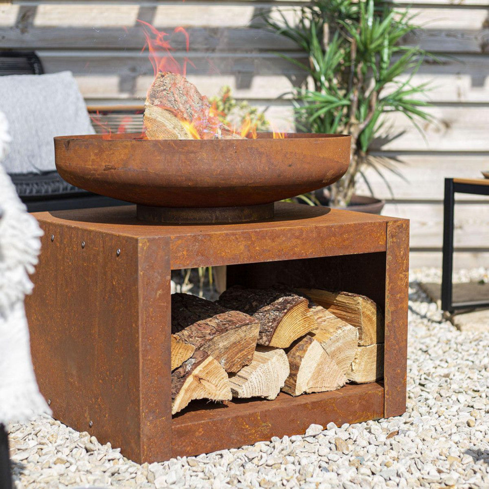 The modern rustic fire pit and log holder in situ