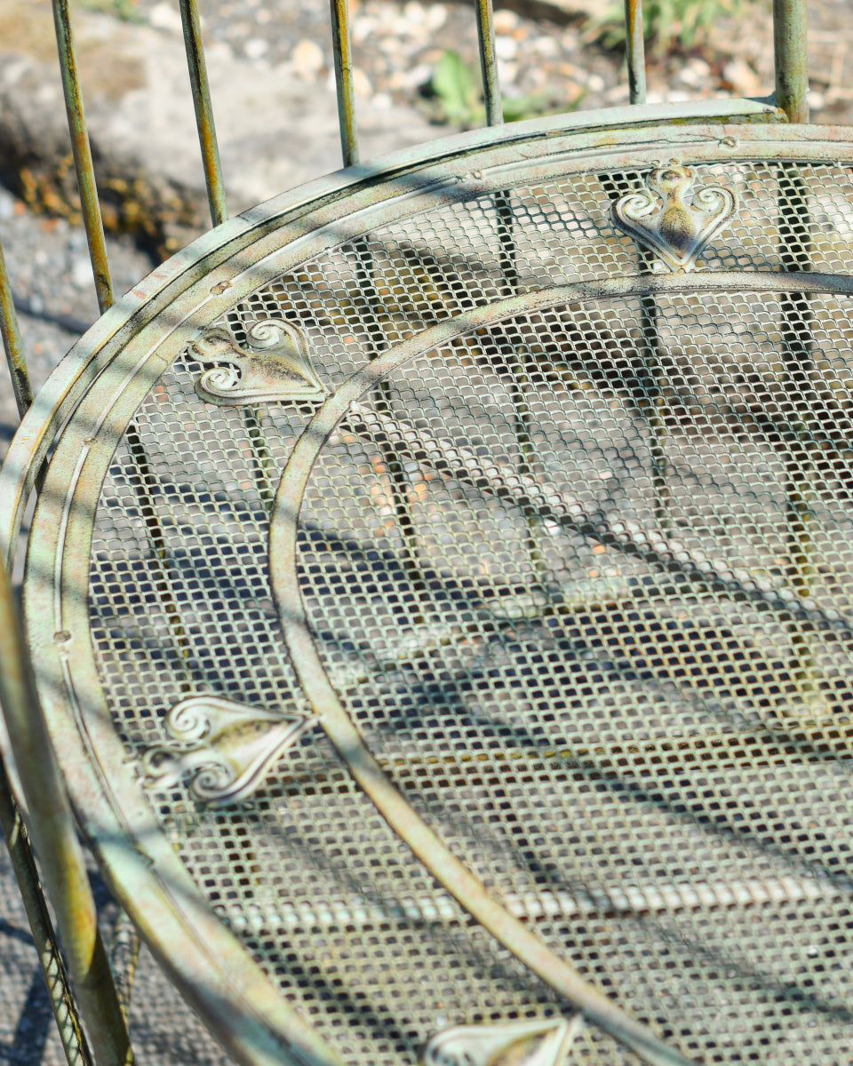 Magnified view of the ornate rustic seat