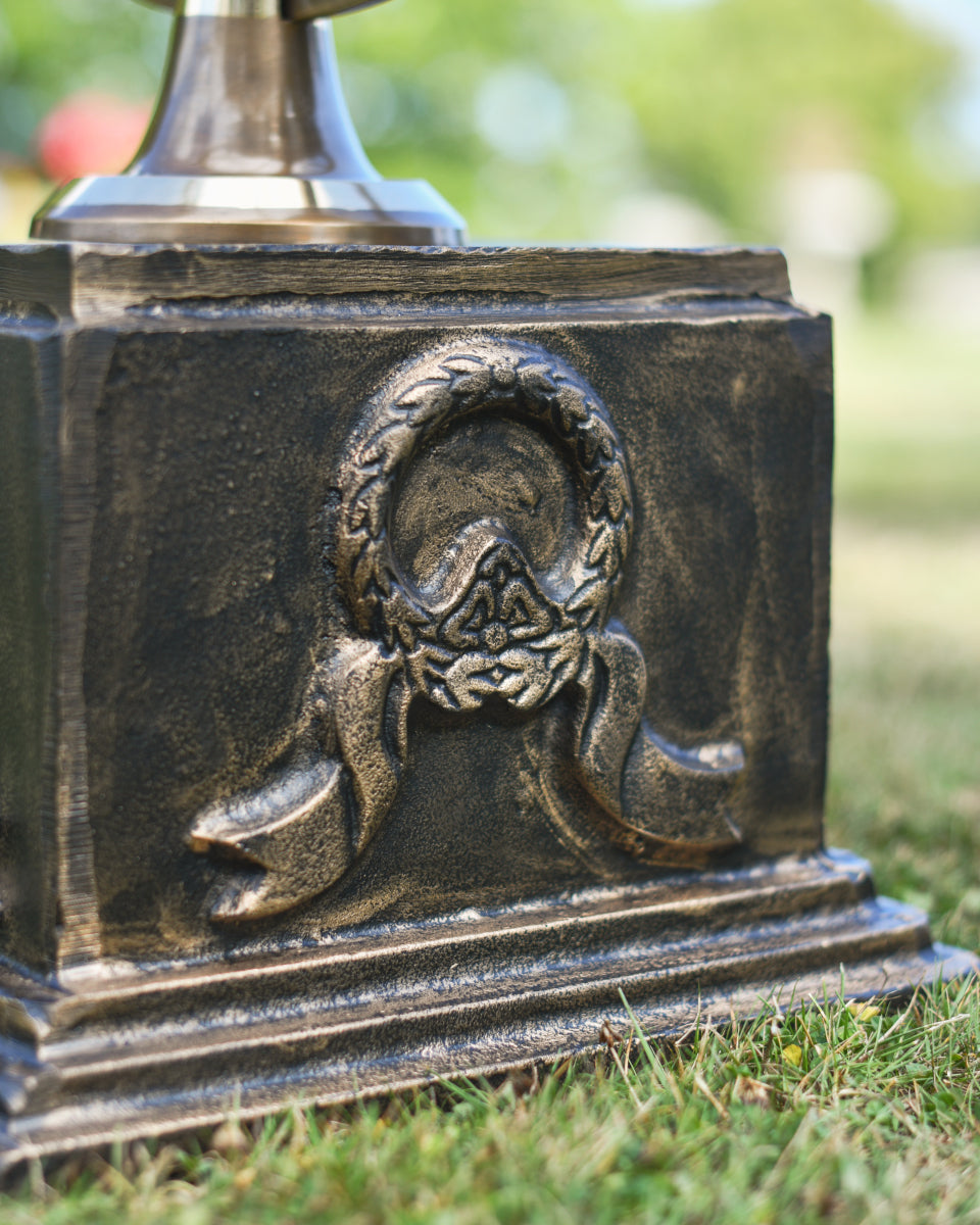 Close up of the ornate wreath and ribbon motif 