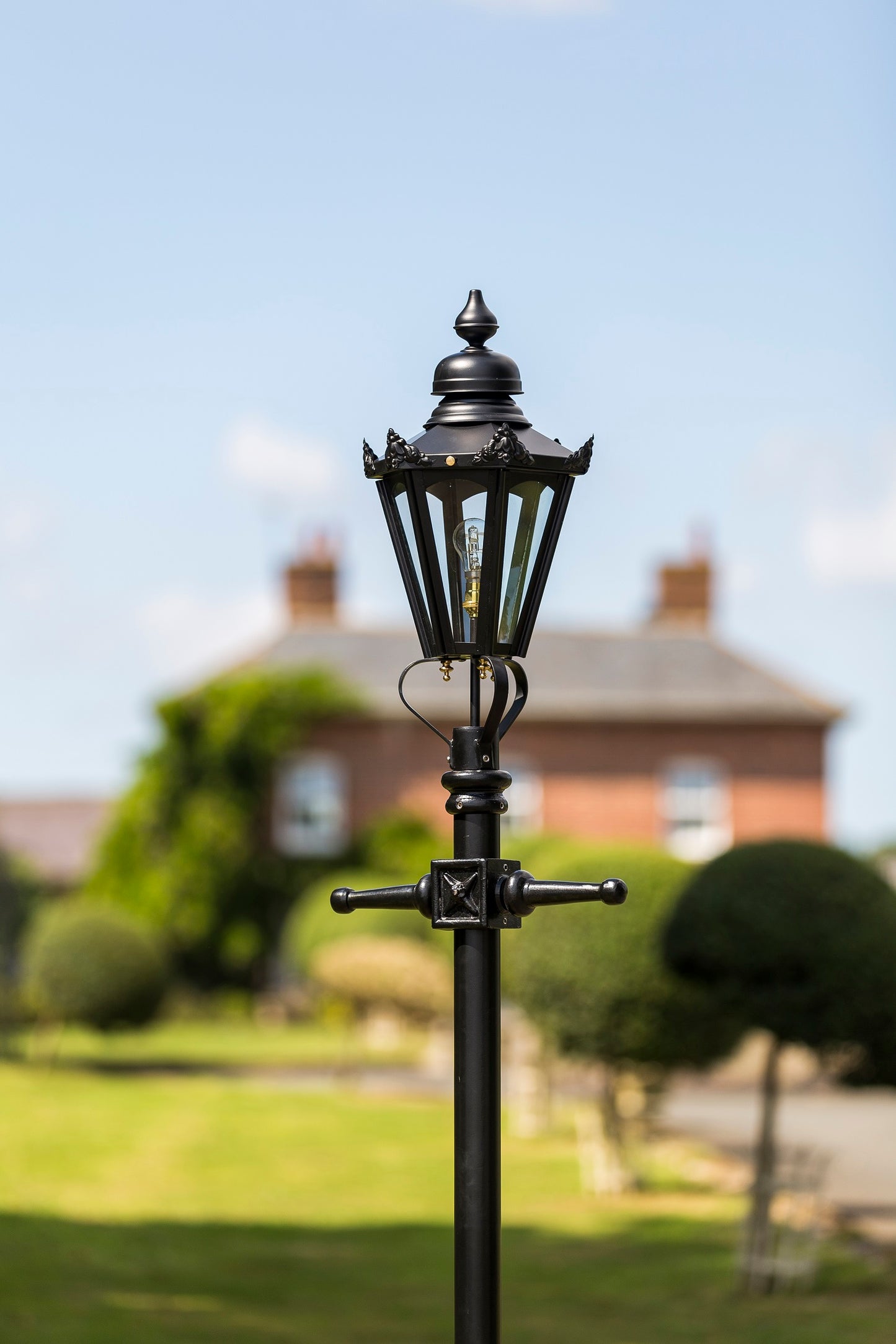 Small Victorian Hexagon Lamp Post In Garden Setting