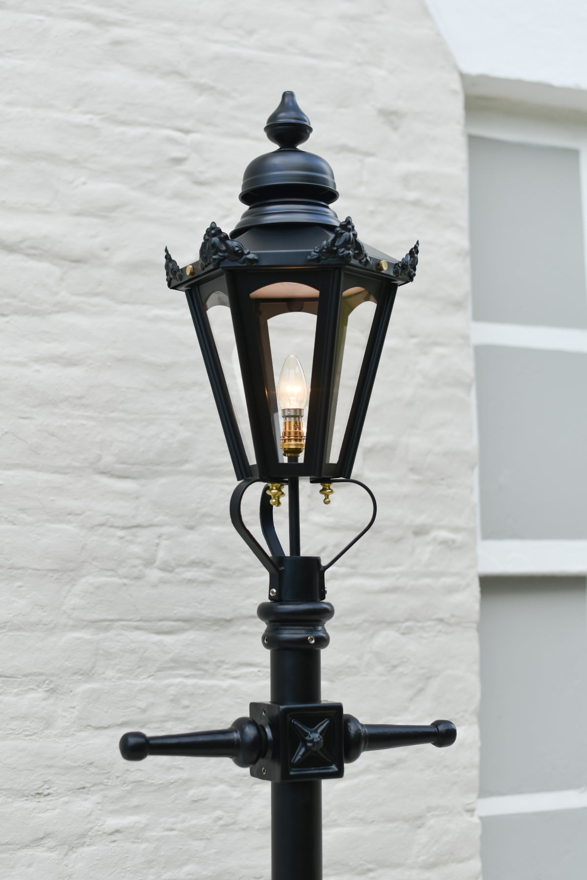 Small Victorian Hexagon Lamp Post In Garden Setting