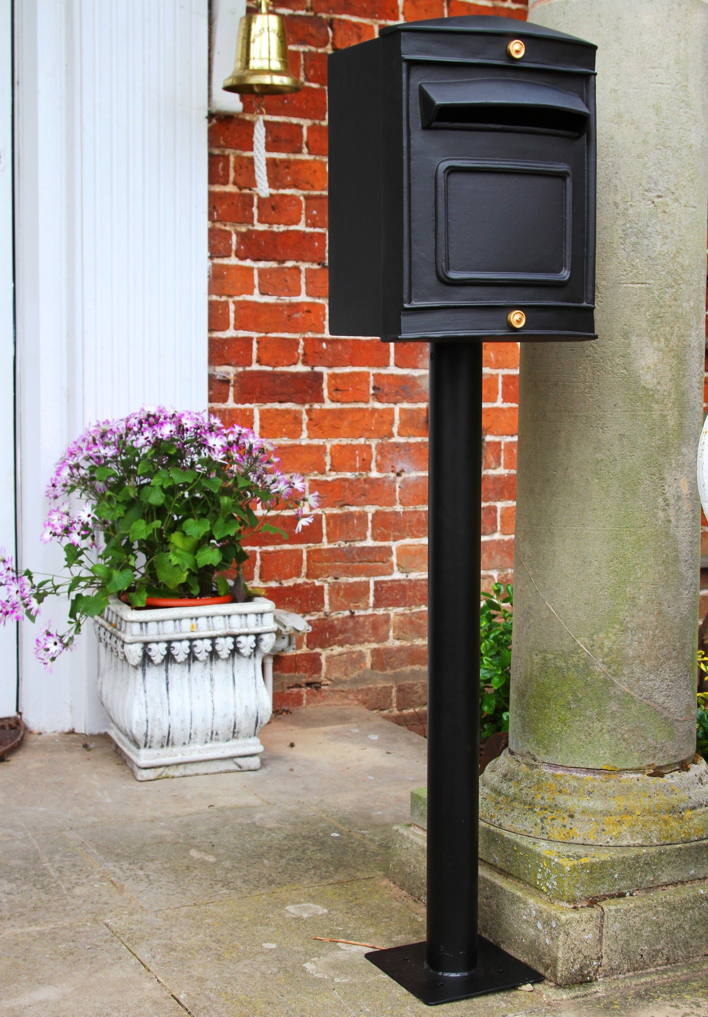 stafford rear opening post box black in front of house