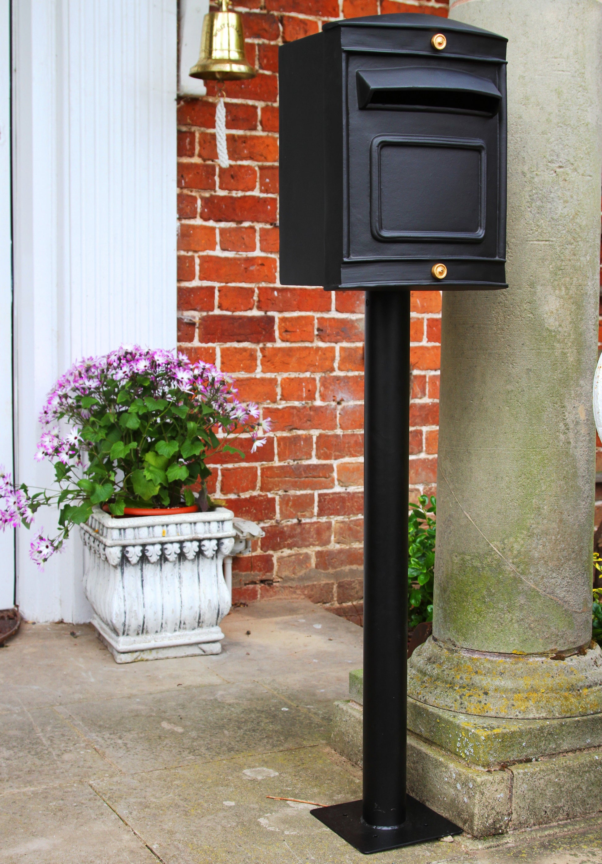 stafford rear opening post box black in front of house
