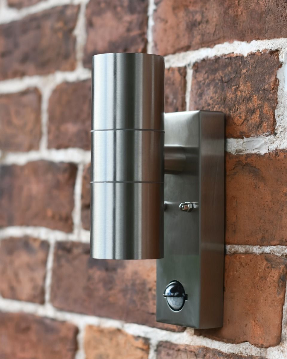 Stainless Steel Contemporary  Downlighter Wall Light in Situ on a Brick Wall