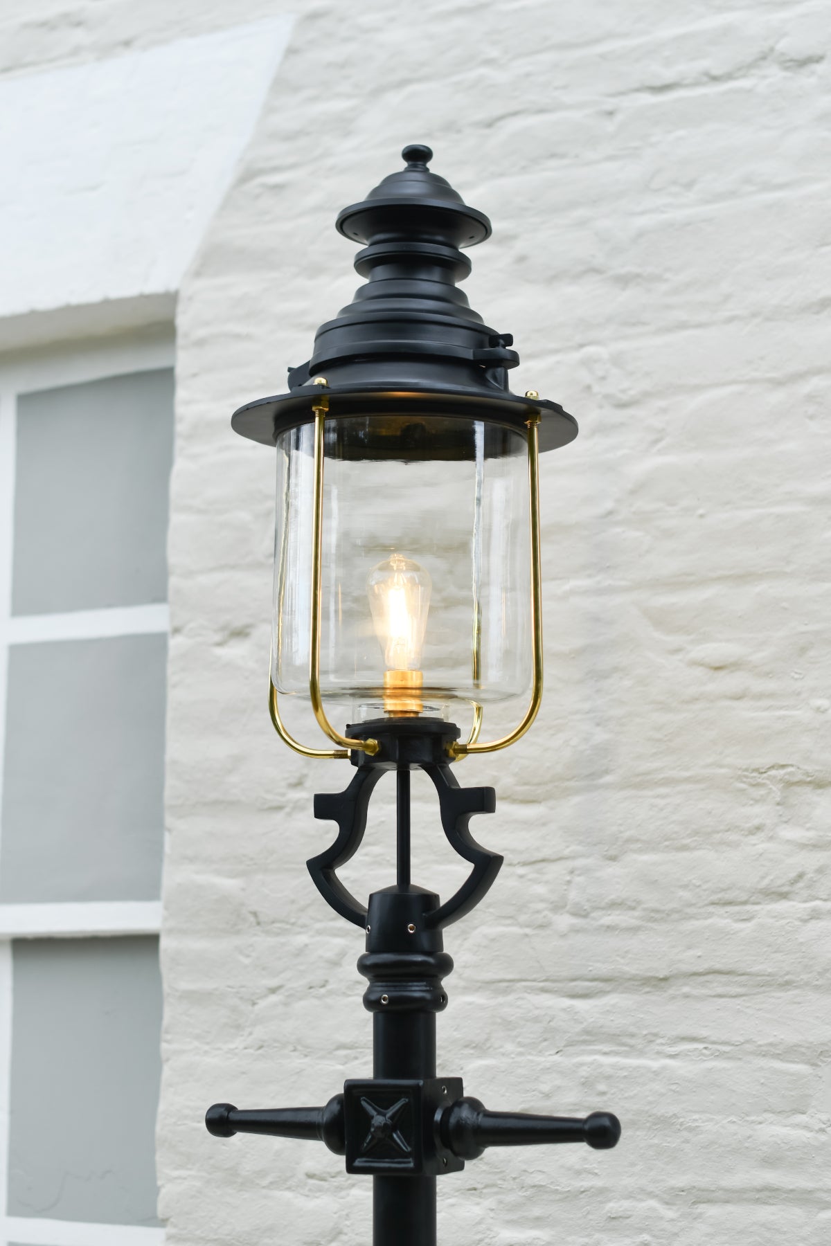 The cast iron ladder bars and lantern of the small Belgravia lamp post