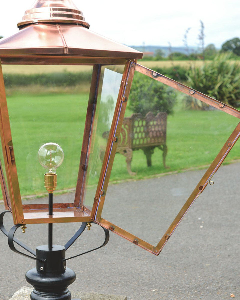 The copper lantern with its hinged door open 