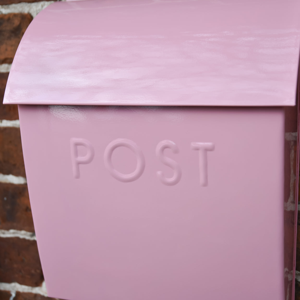 The embossed lettering of the post box - POST