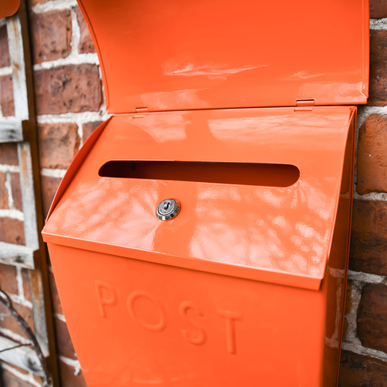 The letter aperture of the Orange Lockable 'Montcour' Modern Post Box