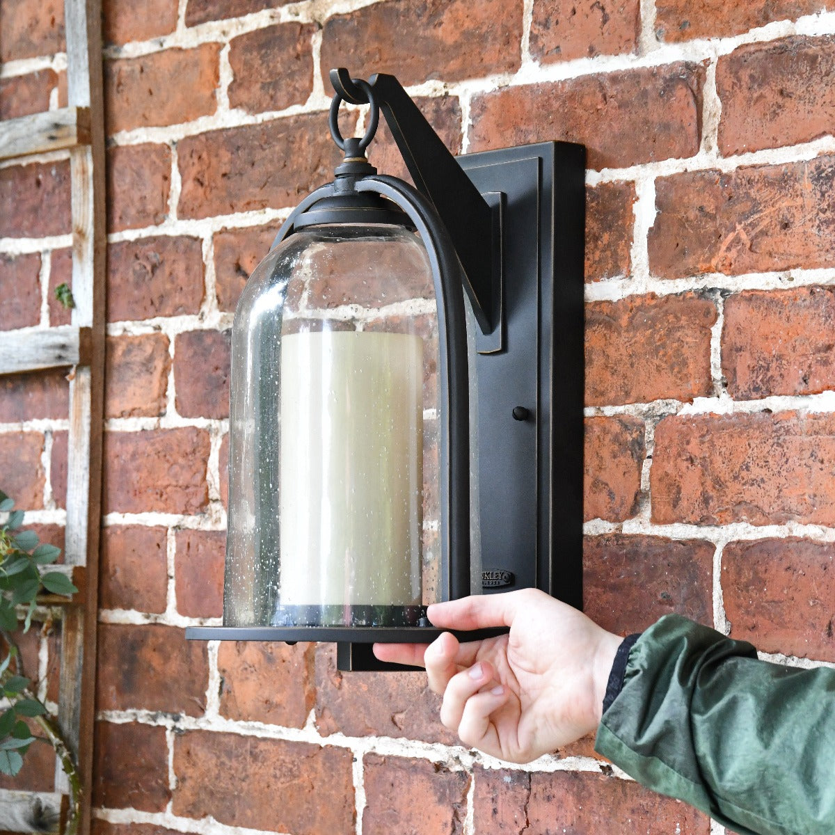 Traditional Bell-Shaped Glass Wall Lantern With Hand For Scale