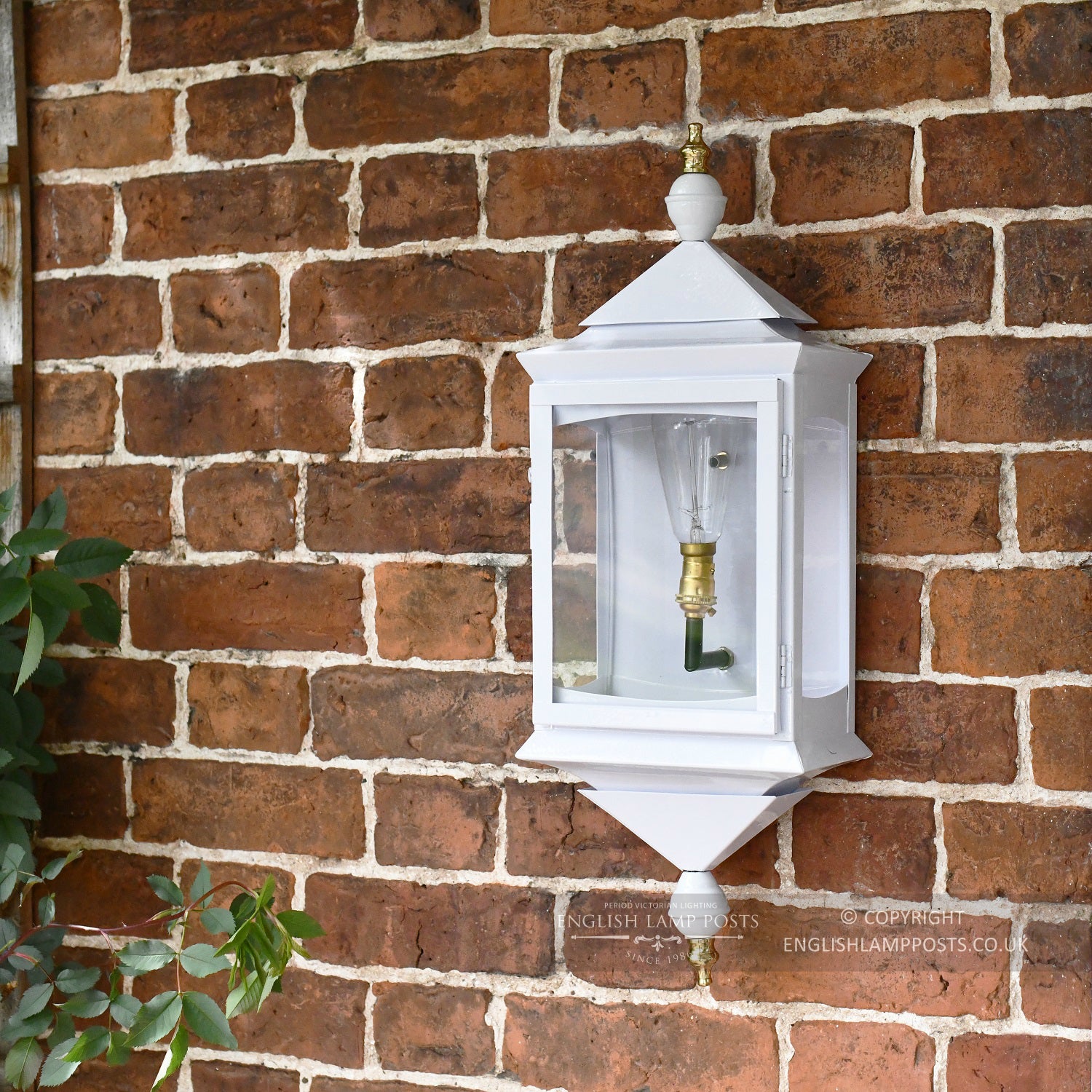 Traditional White Wall Lantern Installed On Red Brick Wall