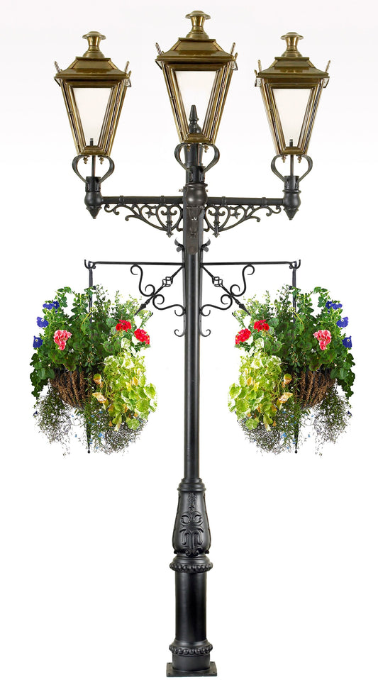 Traditional triple headed lamp post with flower baskets 