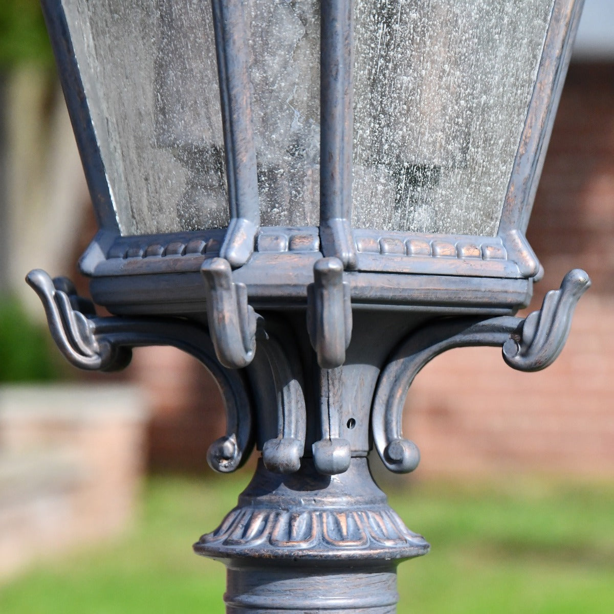 Close up of textured pane and decorative pillar light 
