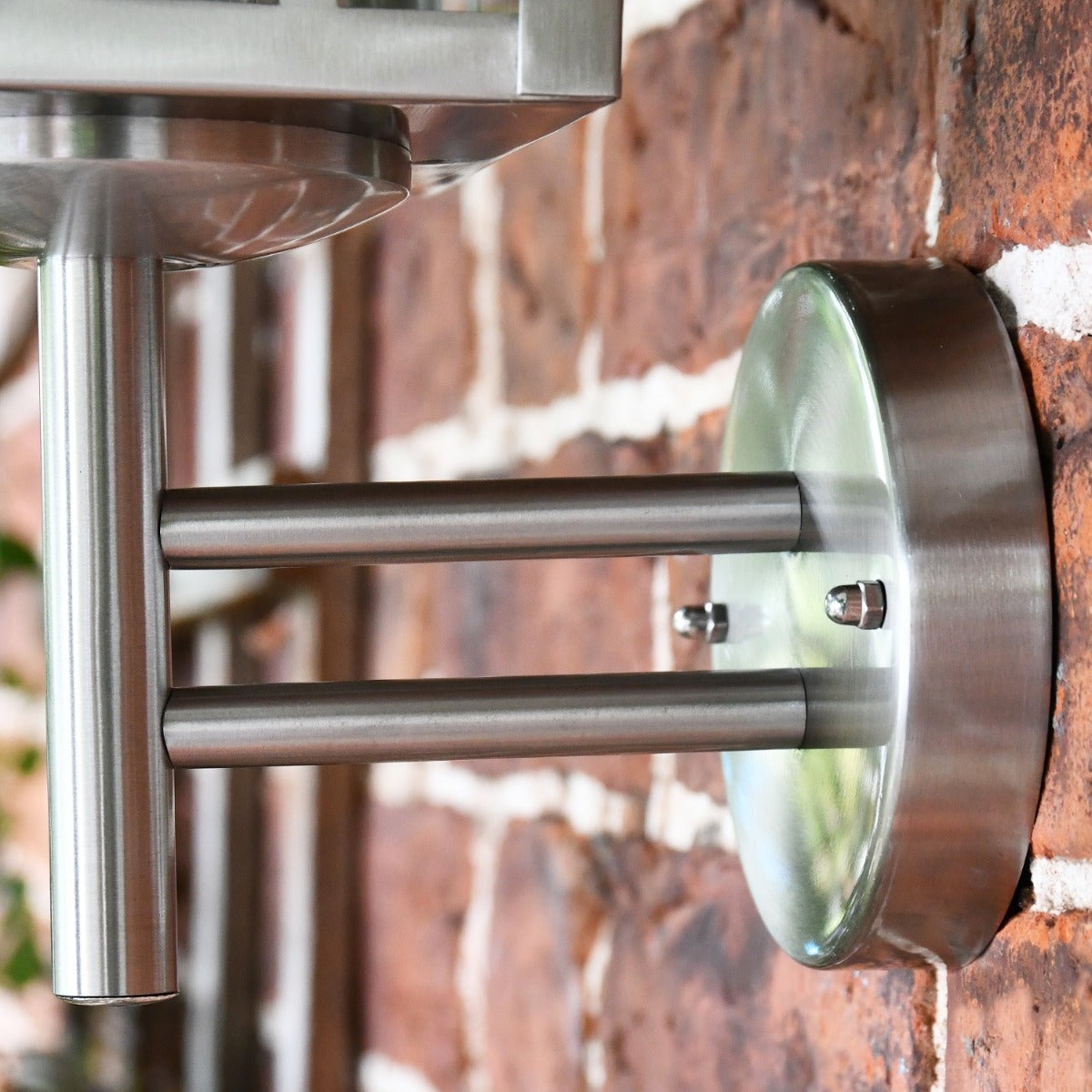 Close up of circular mounting bracket and arm 