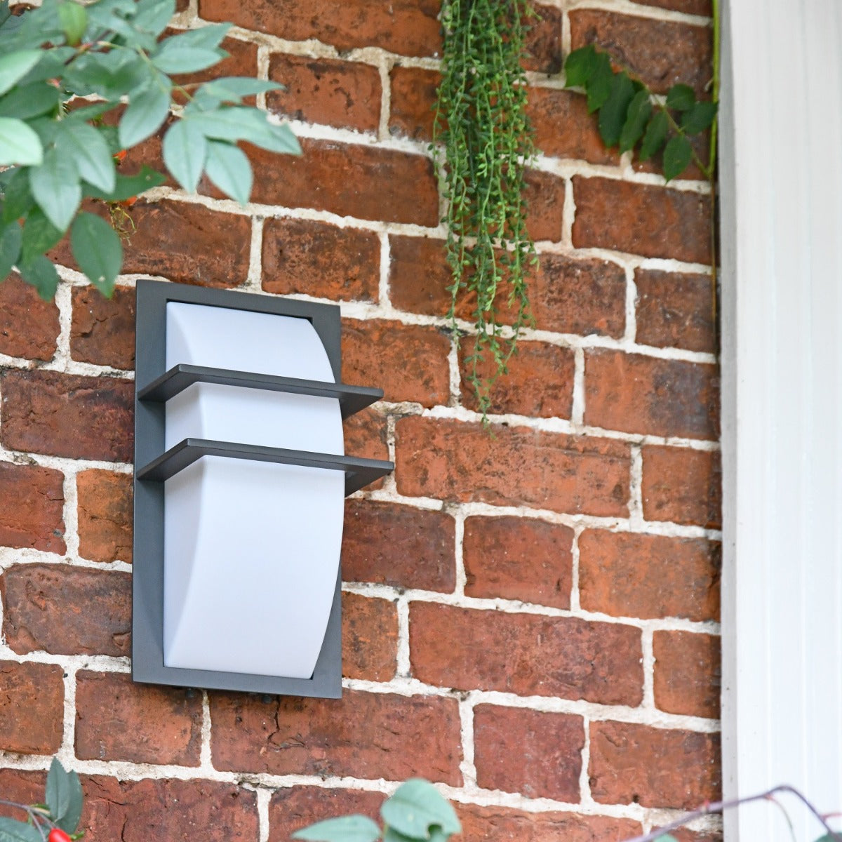 Wall mounted black rectangular light in situ 