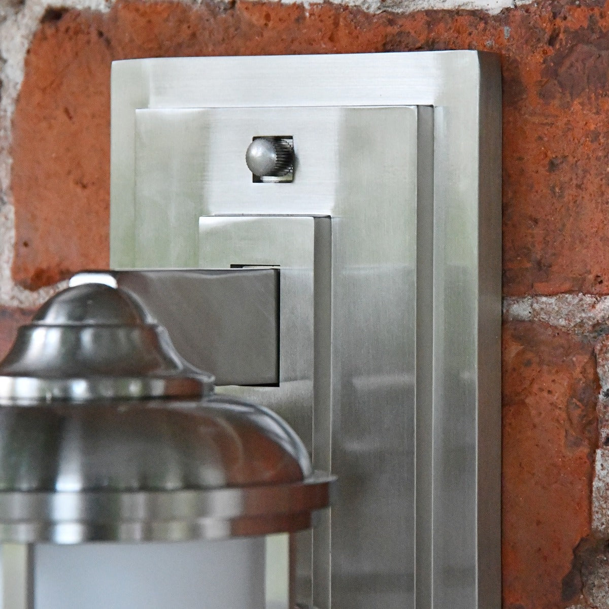 Close up of rectangular brushed zinc back plate 