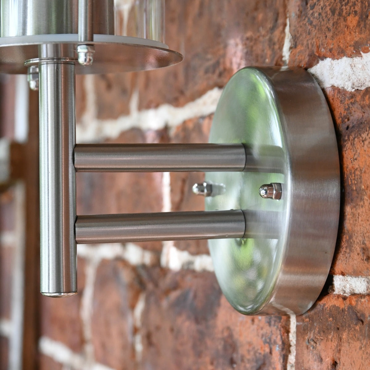 Close up of circular mounting bracket and arm 