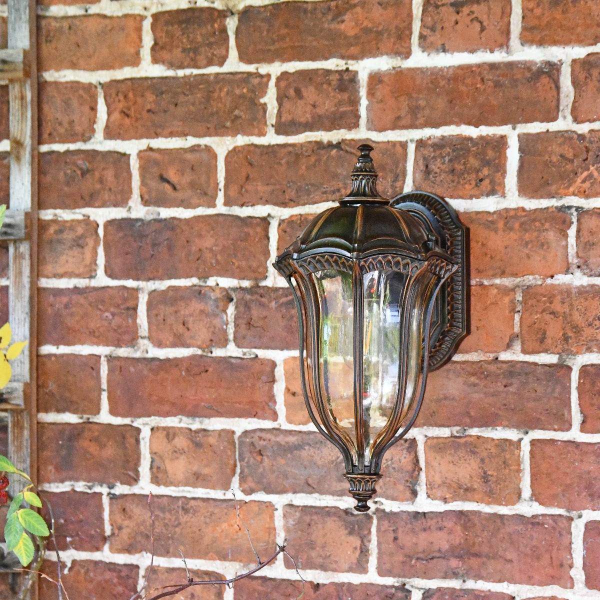 Antique Bronze Small Ornate Lantern On Brick Wall