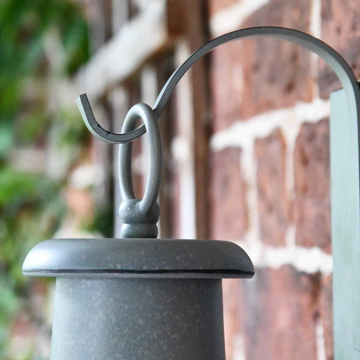 Close up of wall mounted bracket and loop hole. 