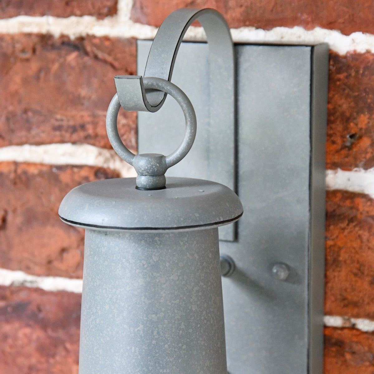 Close up of rectangular bracket and loop hole on lantern 
