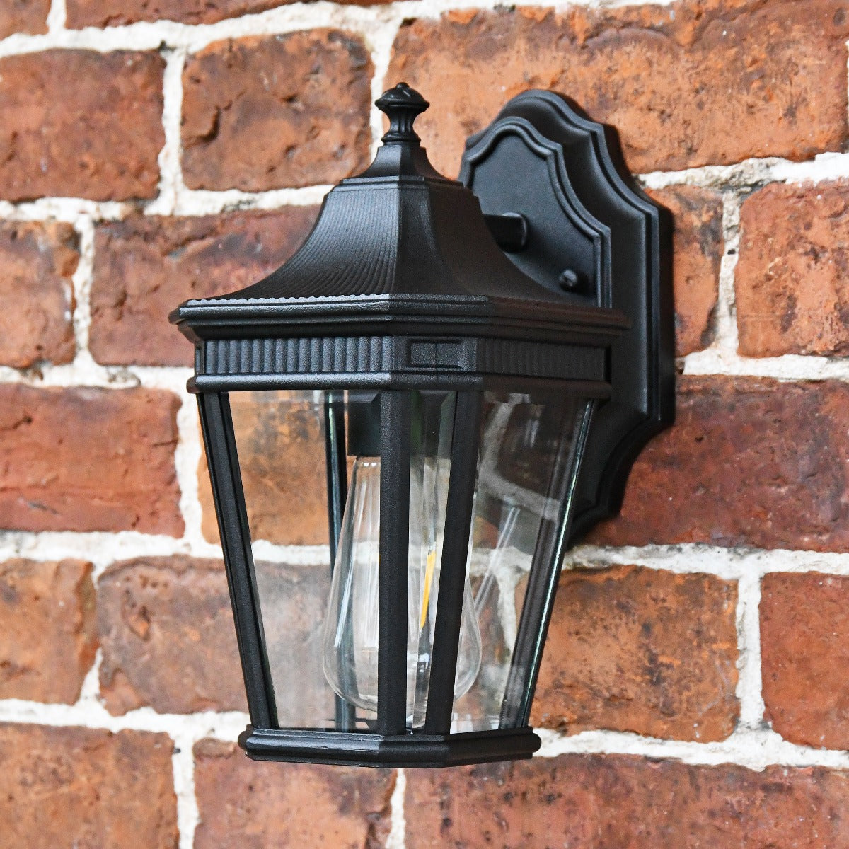 Black Georgian Wall Lantern and Bracket On Brick Wall