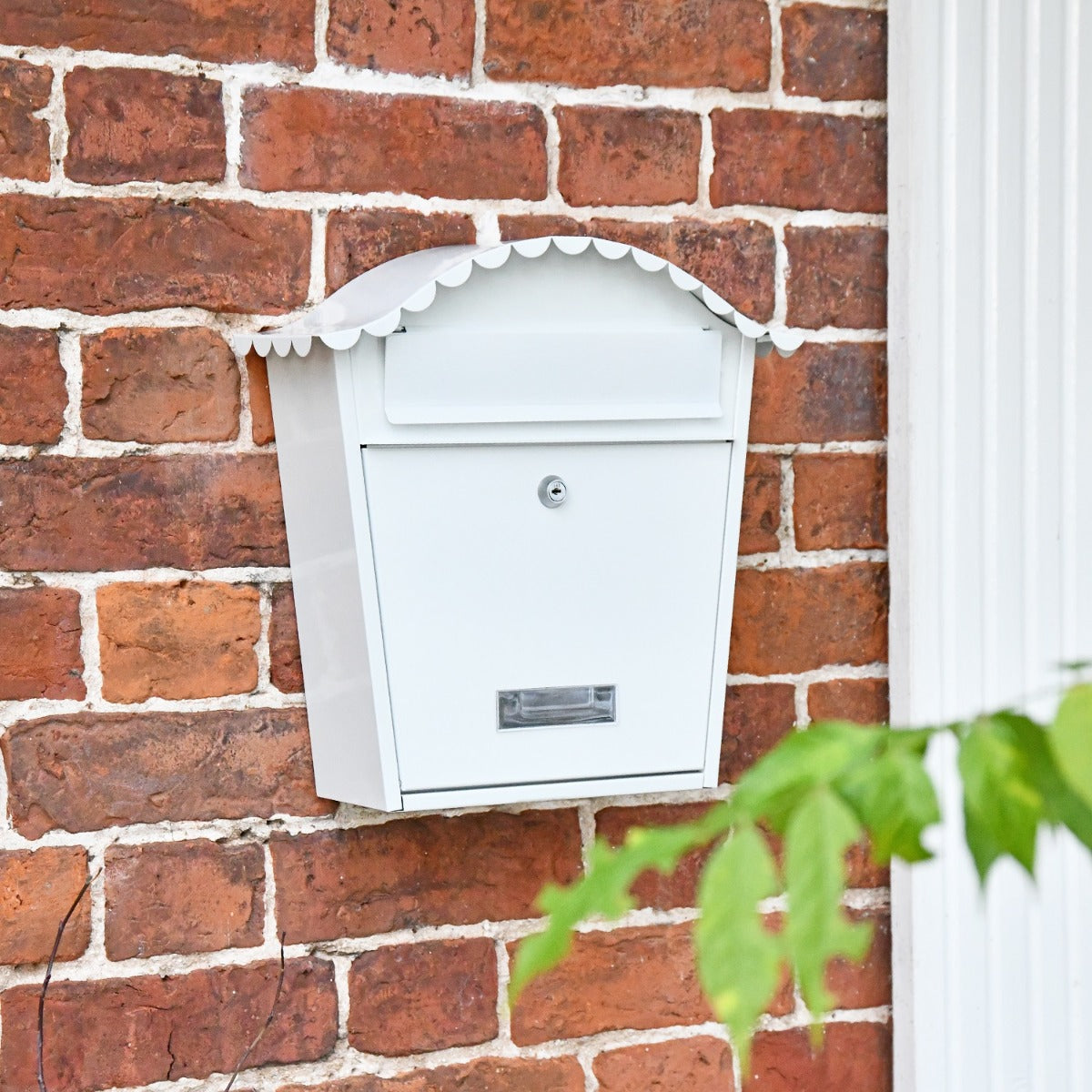 Close up of Traditional Wall Mounted Post Box on Wall 