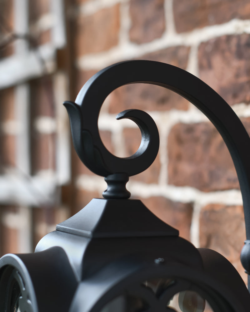 Close up of the scrolled arm bracket 