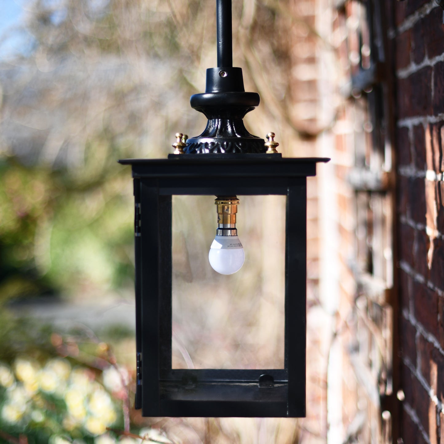 Wall mounted hanging lantern finished in black