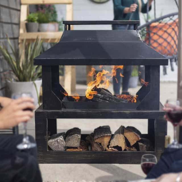 'Whirley' Outdoor Bronze Log Burner And Holder - thumbnail