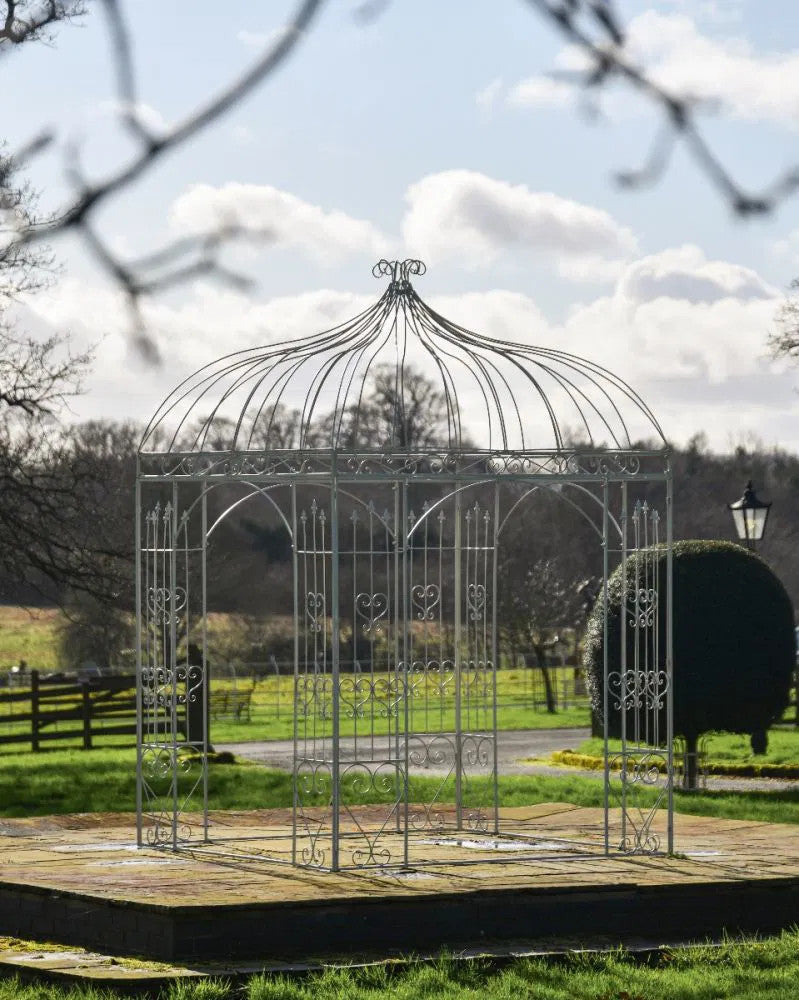 'Alvanley' Wrought Iron Cream Gazebo on a patio