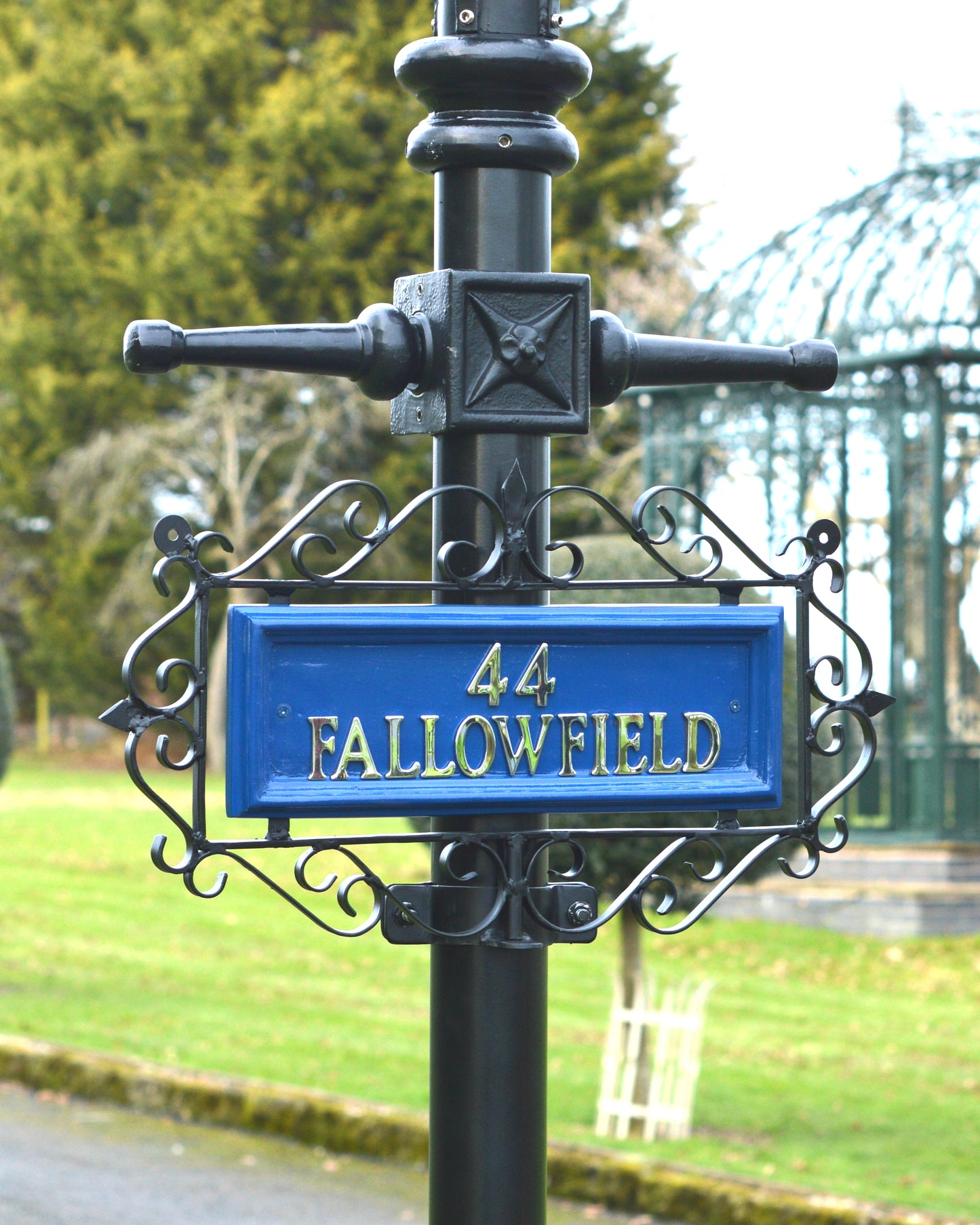 Blue and Black Ornate Scroll Wrought Iron Lamp Post Sign