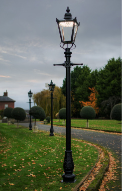 Black Victorian Lamp Post With LED Lantern Fitting At Dusk